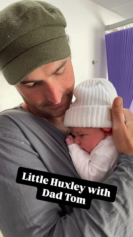 Little Huxley with Dad Tom.