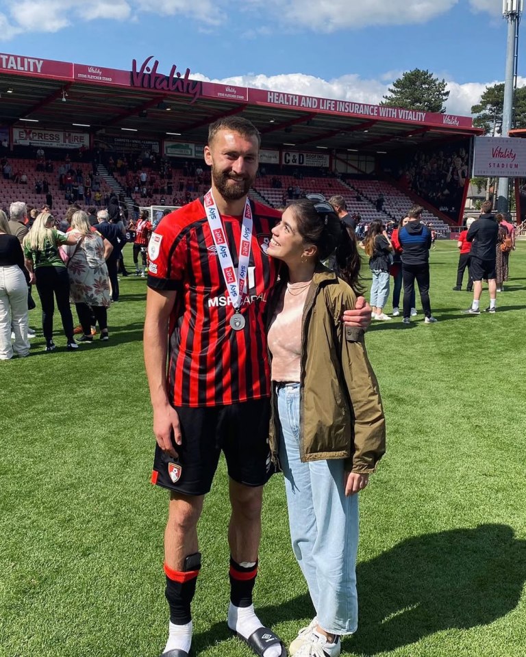 Molly Gallagher and her partner at a soccer stadium.