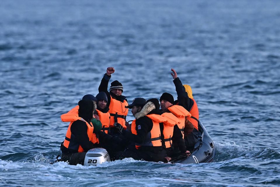 An image collage containing 1 images, Image 1 shows Migrants in a small inflatable boat crossing the English Channel
