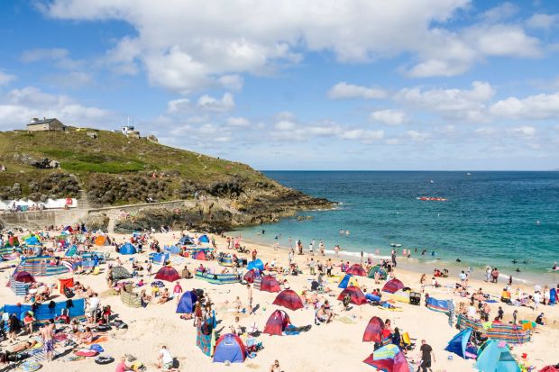 An image collage containing 1 images, Image 1 shows Crowded beach with people enjoying the summer