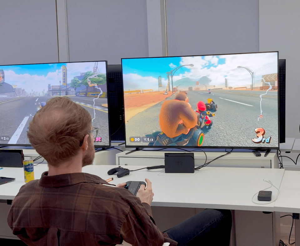 Person playing a racing video game featuring Donkey Kong.