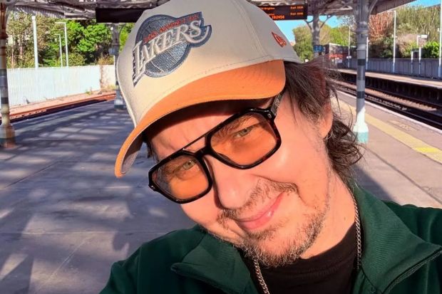 An image collage containing 1 images, Image 1 shows Matt King, known for his role as Super Hans in Peep Show, wearing a Los Angeles Lakers baseball cap
