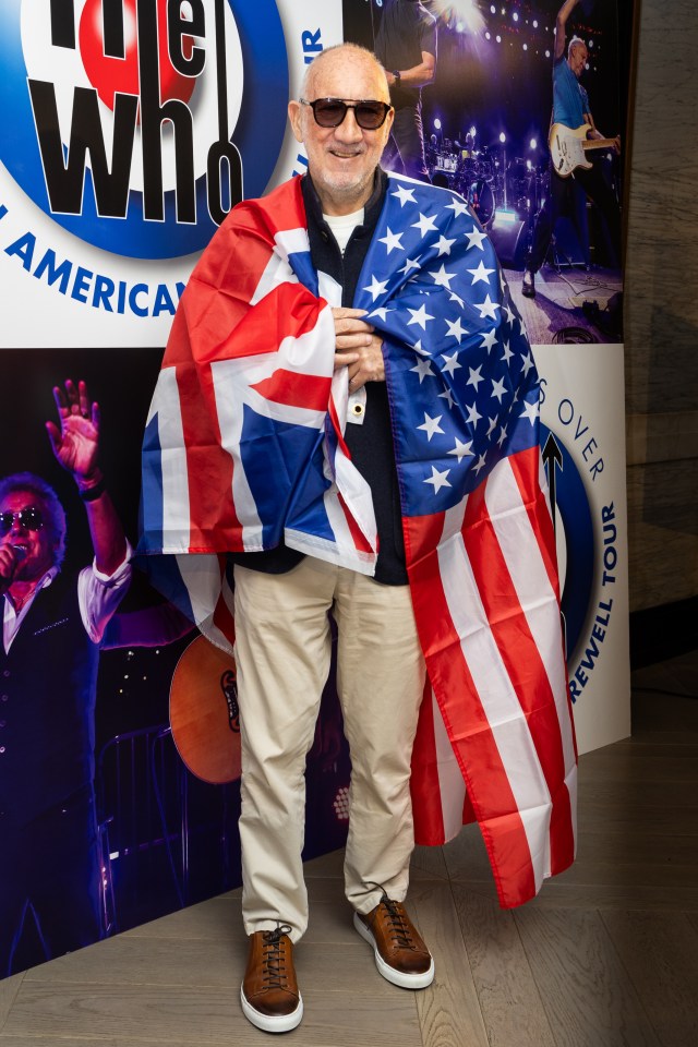 Pete Townshend holding an American and a British flag.