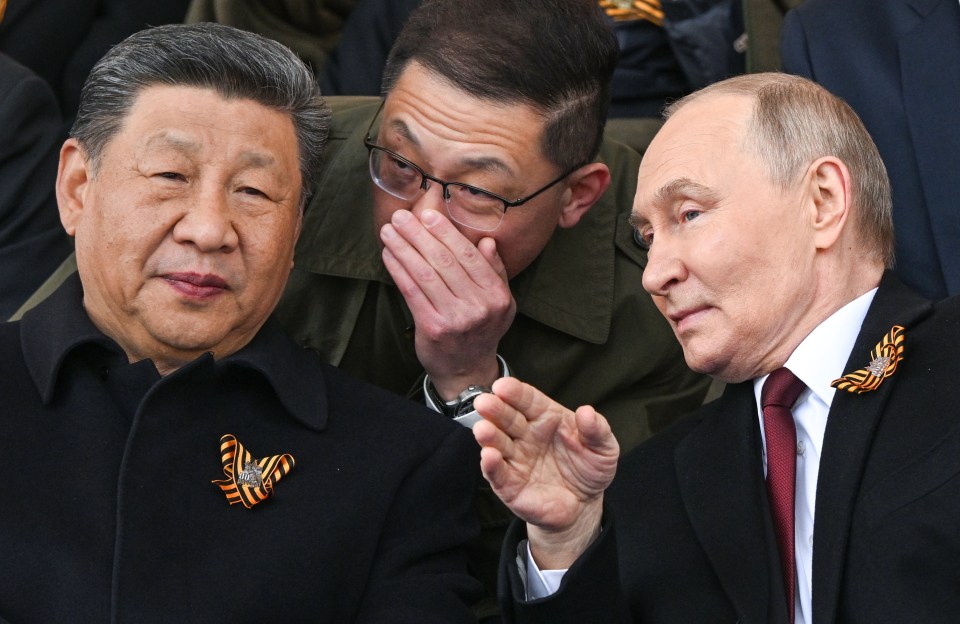 Xi Jinping and Vladimir Putin seated together.