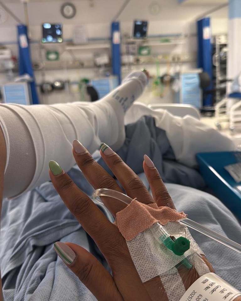 Person in hospital bed with IV drip.