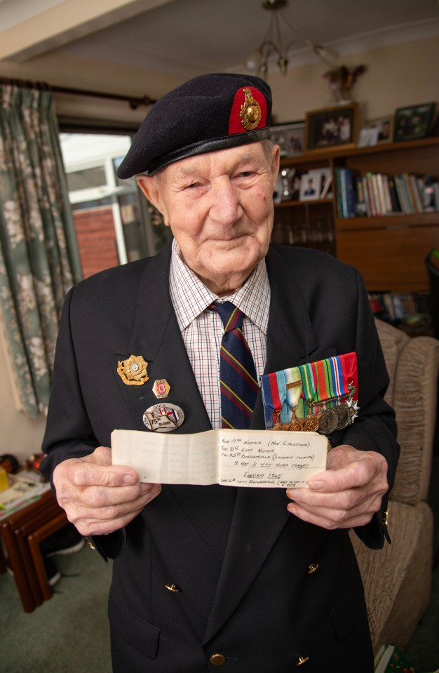 A 99-year-old World War II veteran holds a page from his secret diary.