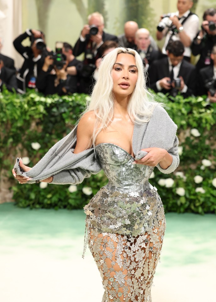 Kim Kardashian at the Met Gala in a silver sequined gown.