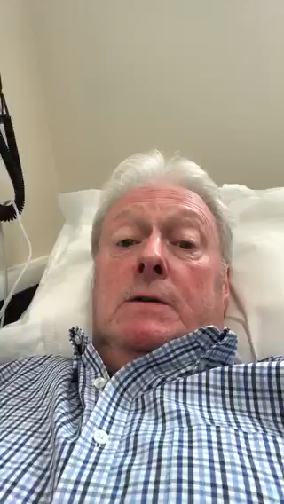 Man in hospital bed.