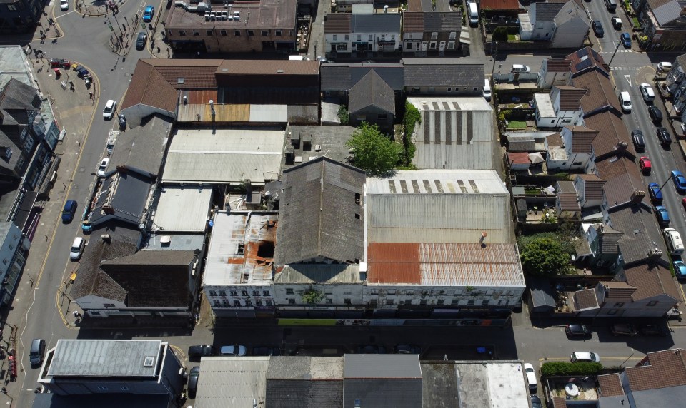 Aerial view of a derelict indoor market.