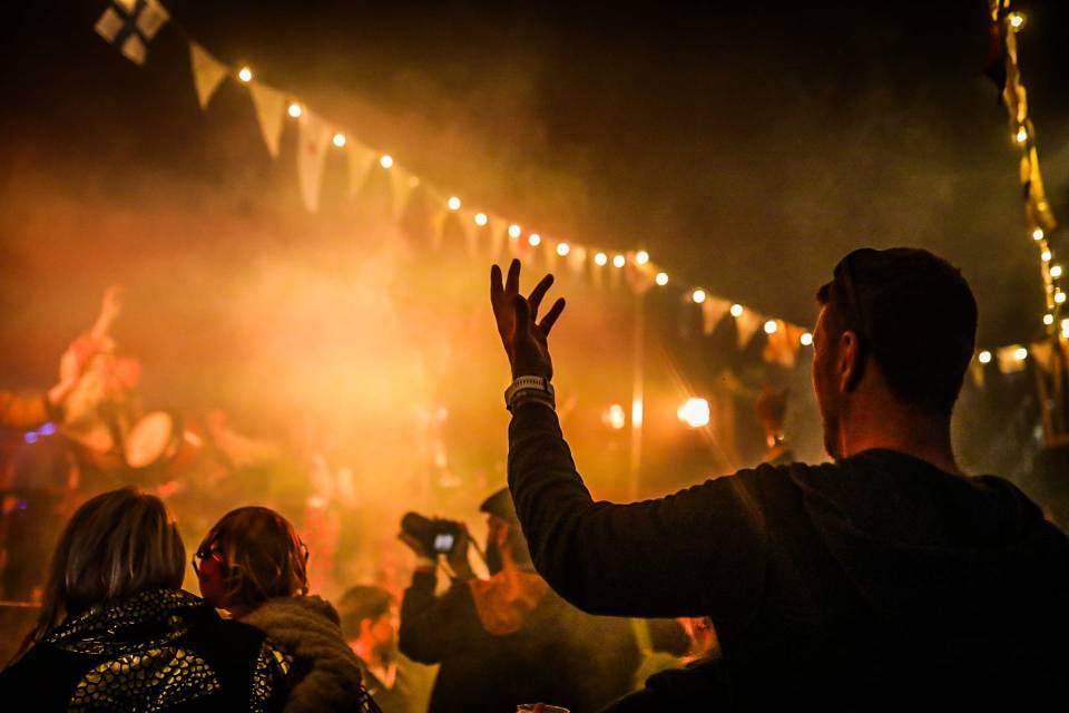 Person raising their hand at a Shindig Festival.