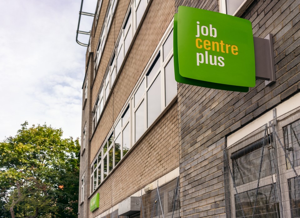 Job Centre Plus sign on a brick building.