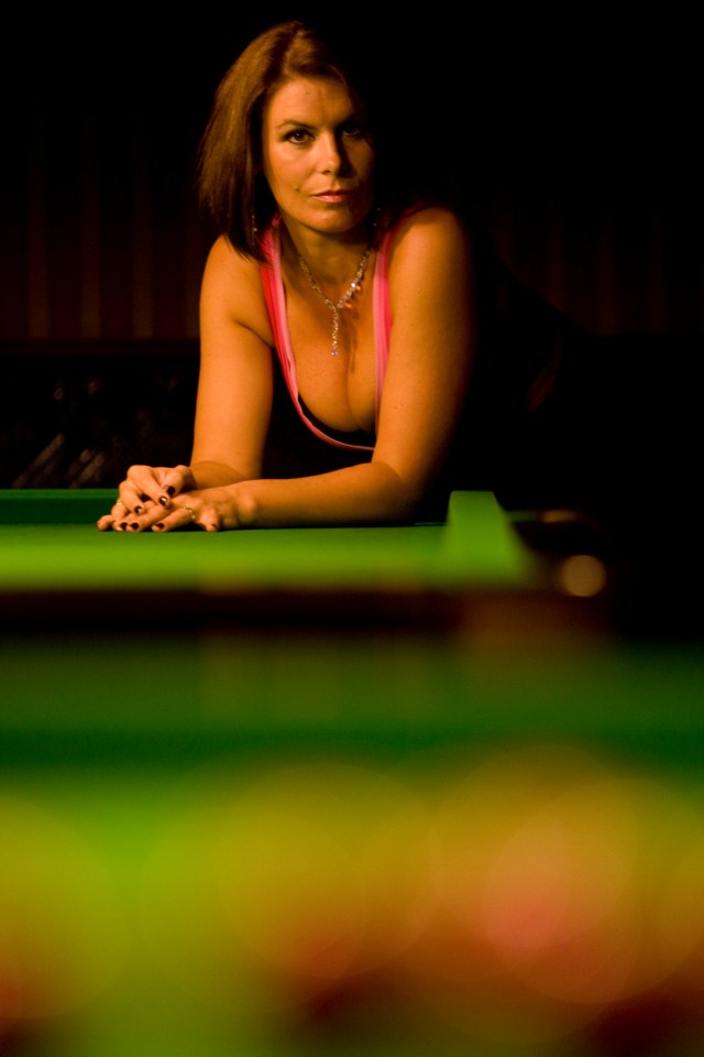 Snooker referee Michaela Tabb posing at a snooker club.