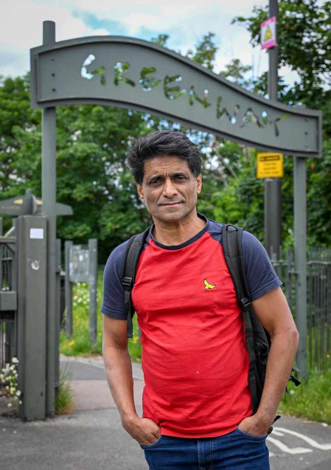 Oliver Harvey, The Sun's chief features writer, standing near a Greenway sign.