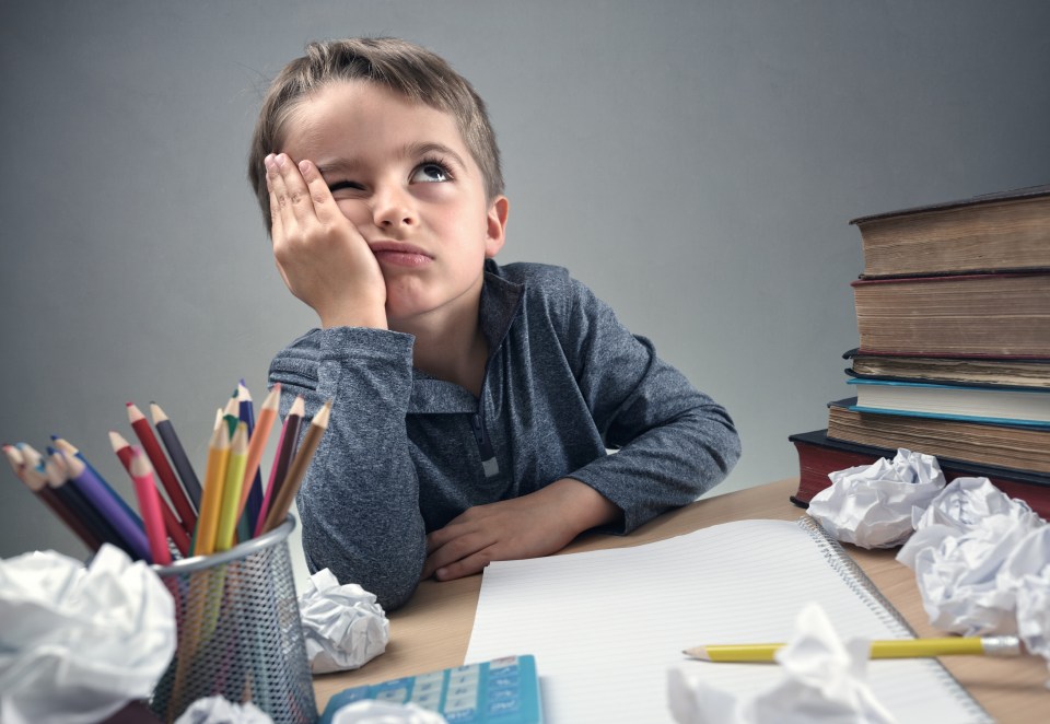 Bored child struggling with homework.