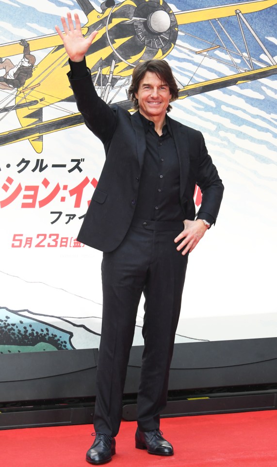 Tom Cruise waving at the Japan premiere of Mission: Impossible - Dead Reckoning Part One.