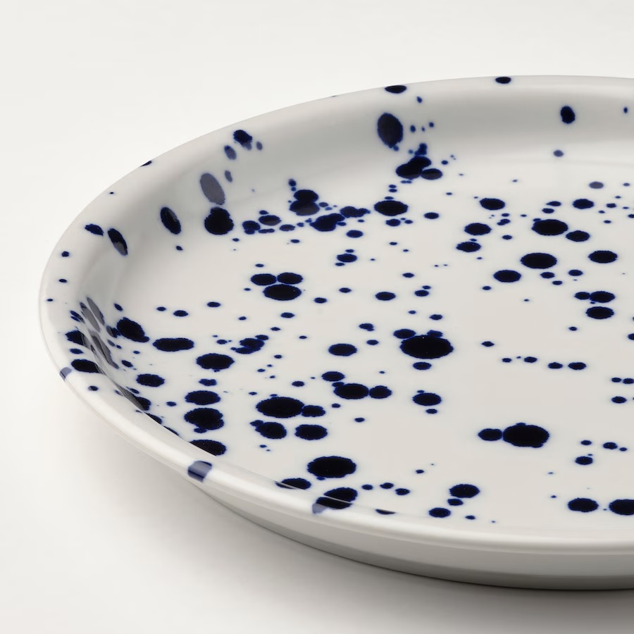 White plate with dark blue splatter pattern.
