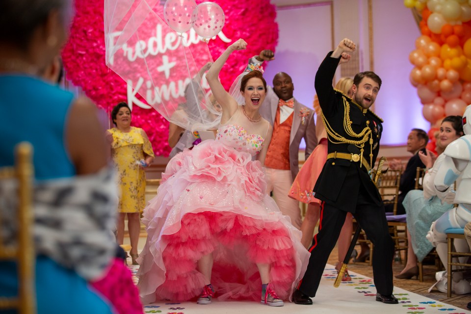Kimmy Schmidt and her fiancé at their wedding.