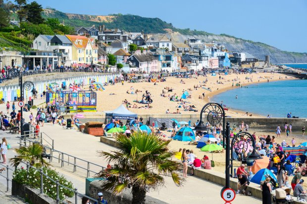 Crowded beach in Lyme Regis, Dorset, UK.