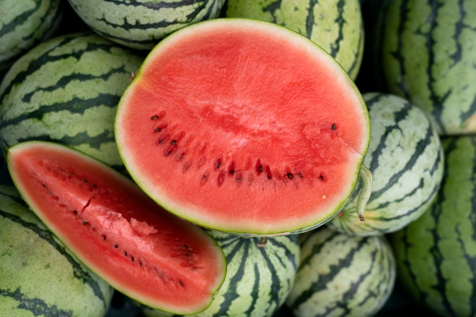 Watermelon slices and whole watermelons.