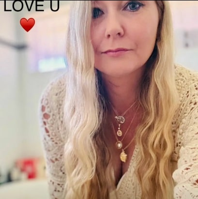 Virginia Giuffre wearing layered necklaces.