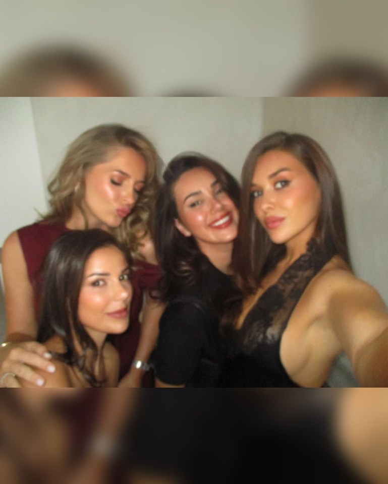 Four women posing for a selfie.