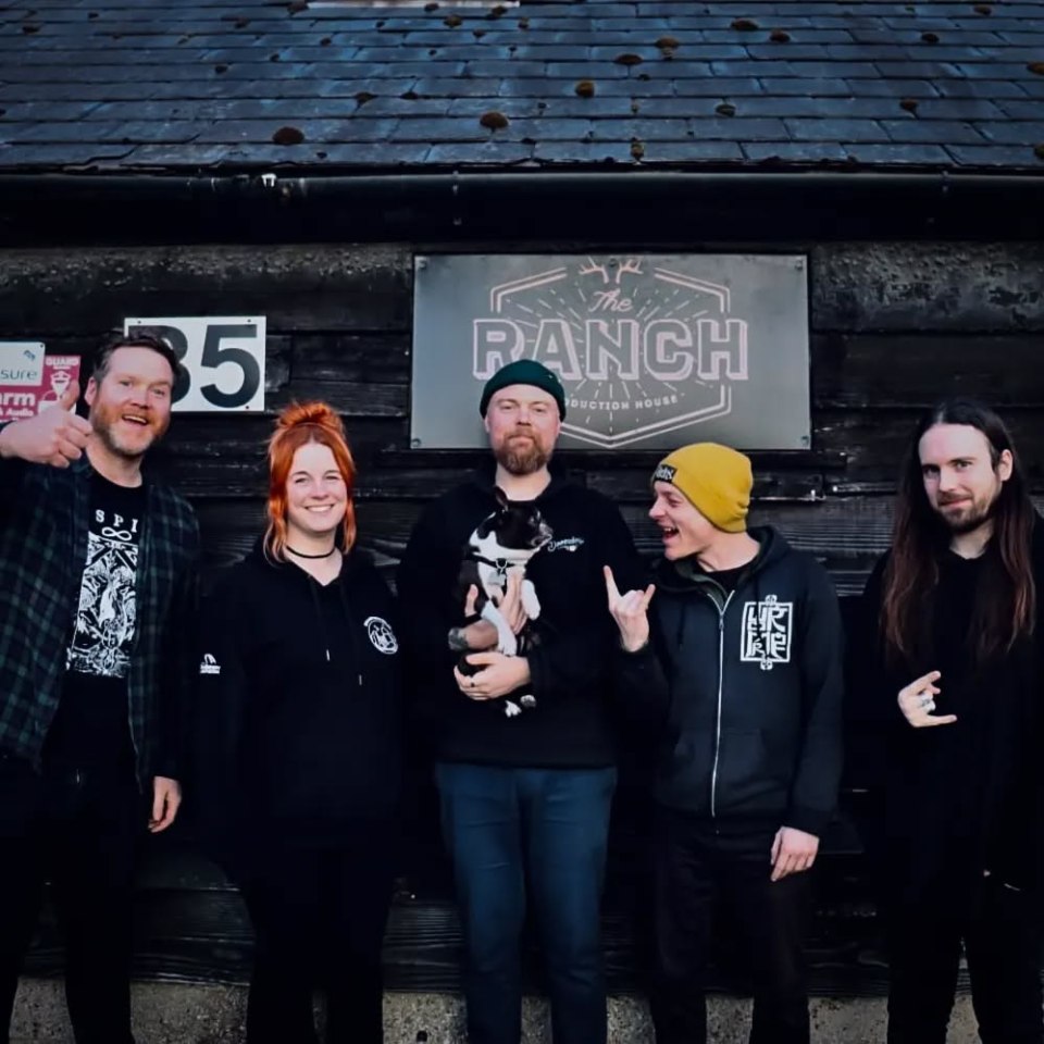Band photo in front of The Ranch Production House.