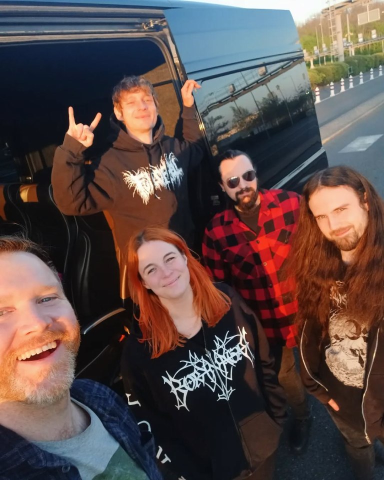 Band photo in a van.