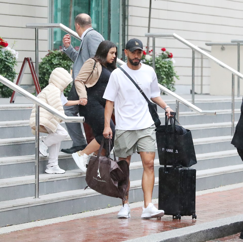 Matheus Cunha and his family leaving a hotel.