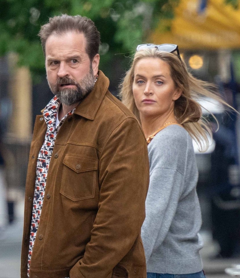 Alfie Boe and his girlfriend walking hand-in-hand in London.