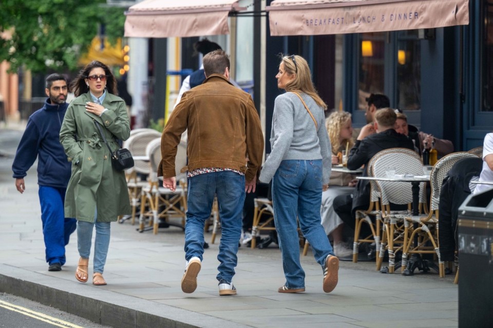 Alfie Boe and his girlfriend walking hand-in-hand in London.