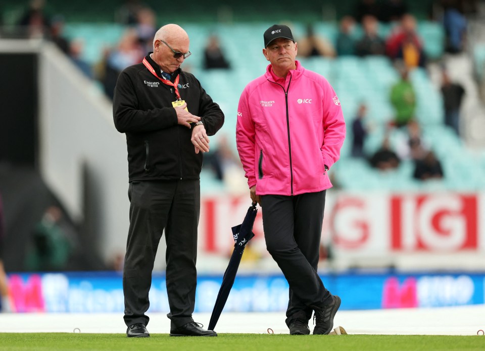 Match referee Jeff Crowe and umpire Graham Lloyd at a cricket match.