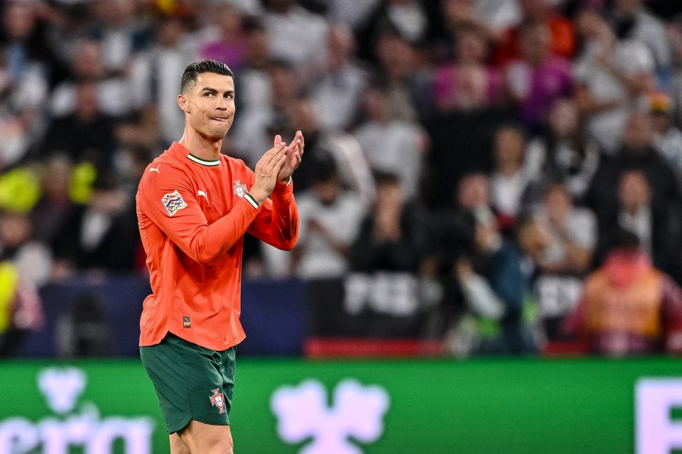 Cristiano Ronaldo of Portugal applauding during a soccer match.
