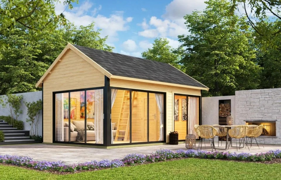 Log cabin with loft and patio furniture.