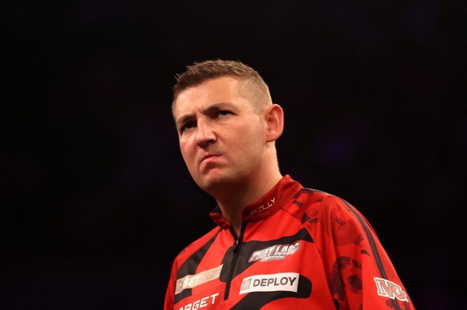 SHEFFIELD, ENGLAND - MAY 22: Nathan Aspinall of England reacts against Luke Littler of England during the 2025 BetMGM Premier League Darts at Utilita Arena Sheffield on May 22, 2025 in Sheffield, England. (Photo by George Wood/Getty Images)