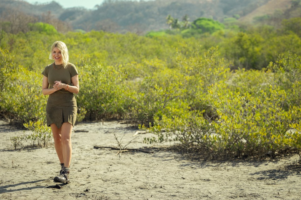 Woman walking in a scrubland.