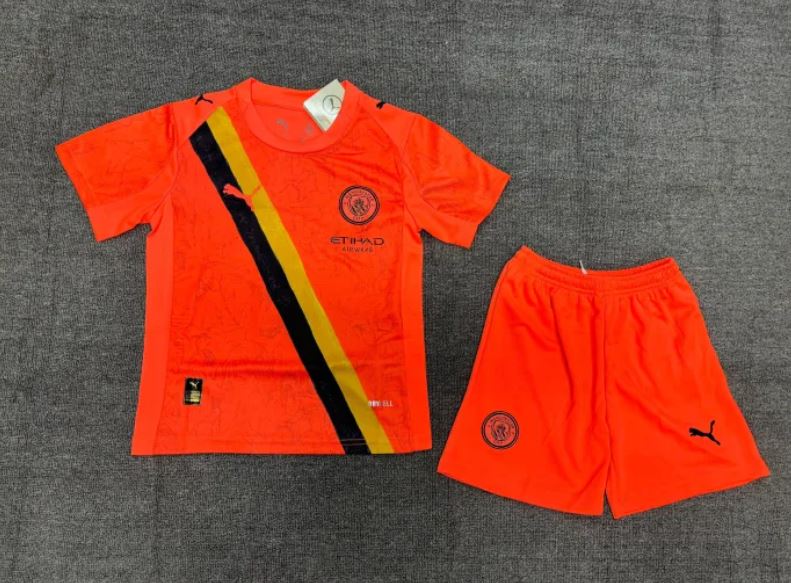 Manchester City youth soccer jersey and shorts.