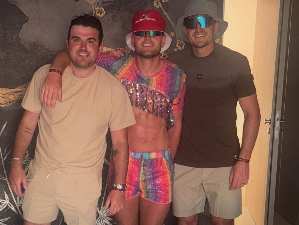 Three men posing for a photo.