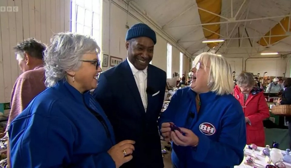 BBC Bargain Hunt expert Ochuko Ojiri with two other people.