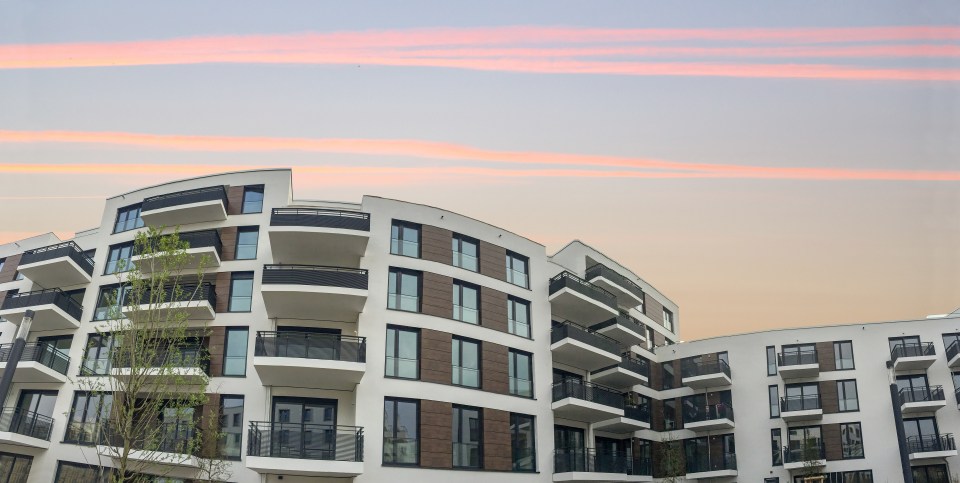 Modern residential building at sunset.