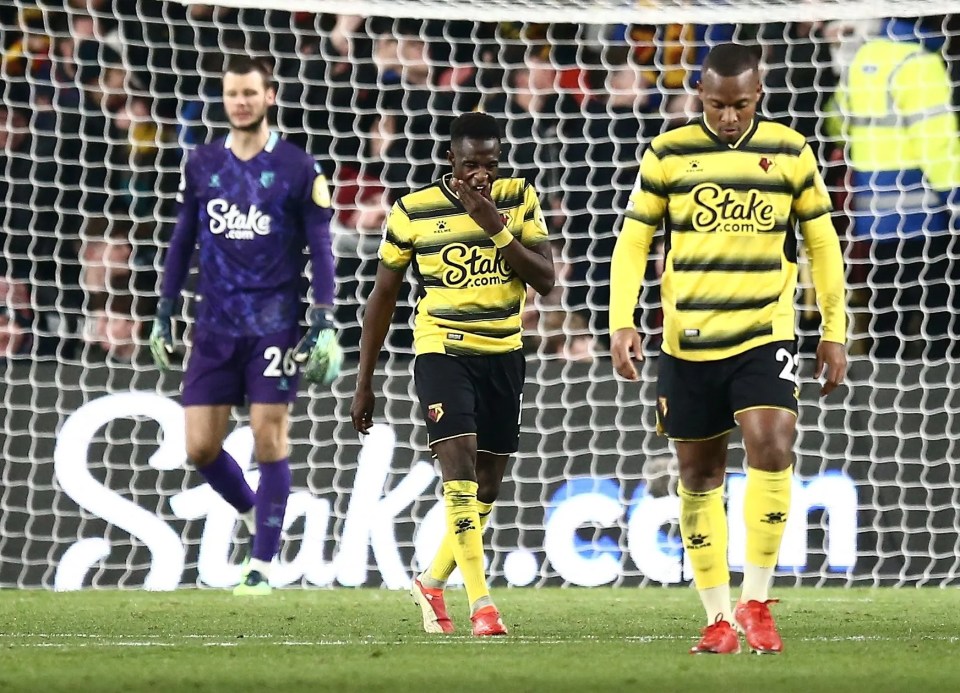 Watford player dejected after conceding a goal.