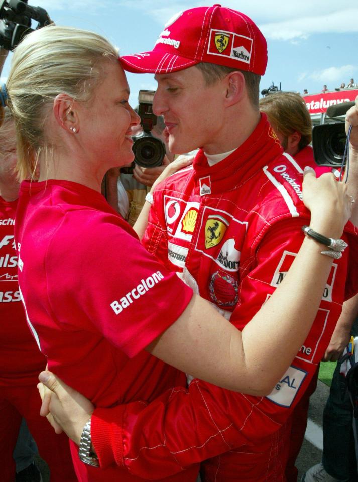 Michael Schumacher hugging his wife Corinna after a race victory.
