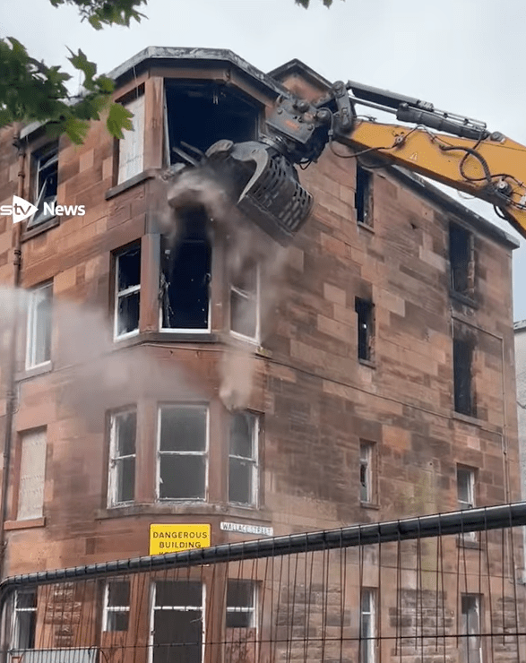 Demolition of a brick building.