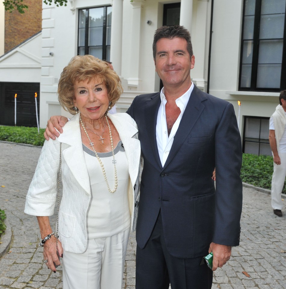 Simon Cowell with his mother Julie Brett at a party.