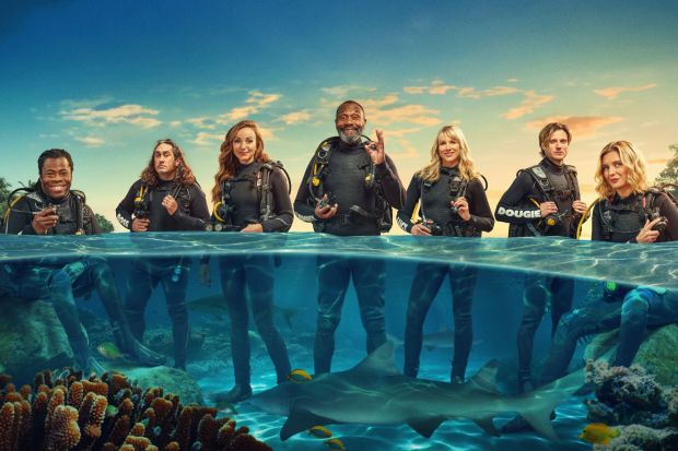 An image collage containing 1 images, Image 1 shows Seven celebrities in scuba gear, partially submerged in water with sharks and coral below