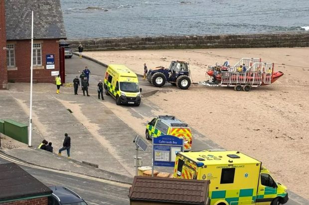 An image collage containing 1 images, Image 1 shows Emergency responders at a beach after a water rescue
