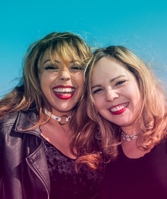 Two smiling women.