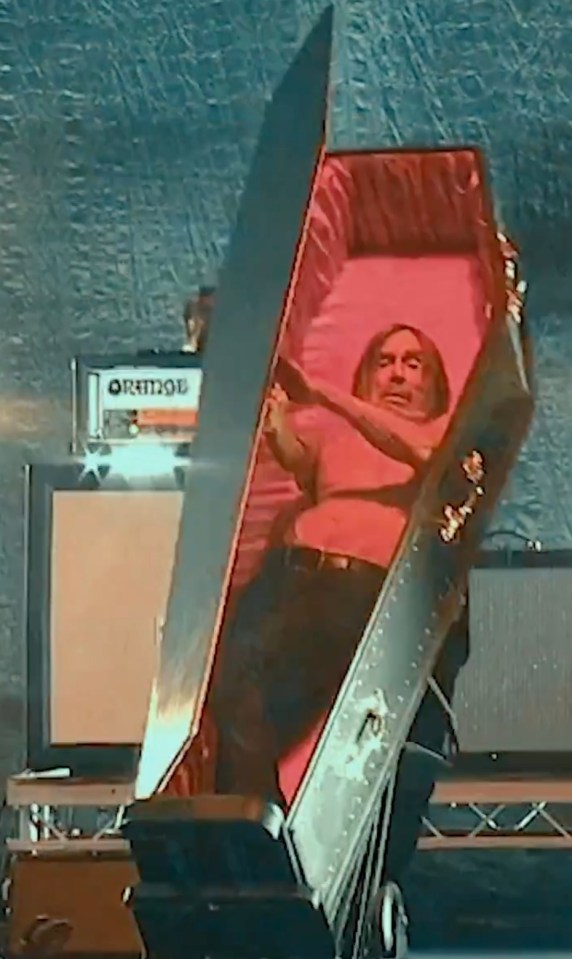 Iggy Pop in a coffin at a UK concert.