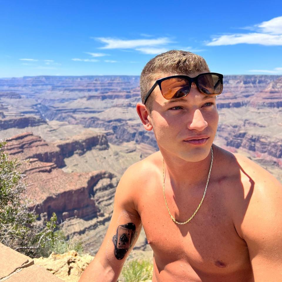 Man at the Grand Canyon with a tattoo.