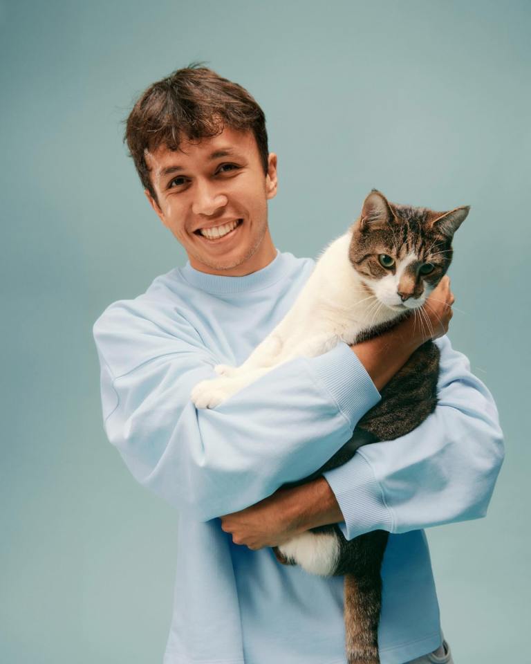 Man holding a cat.